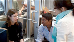 Picture of Sumadhur Shakya and Pan Lu with a University of Utah student in the traffic lab