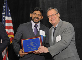 Picture of Ranjit Prasad Godavarthy accepting award